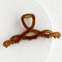 Brown Sugar: A spiral shaped hair claw in brown sugar.