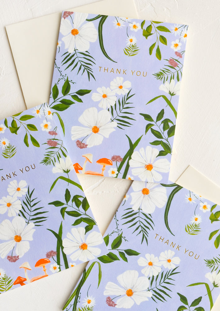 1: Three identical thank you cards in periwinkle floral pattern.