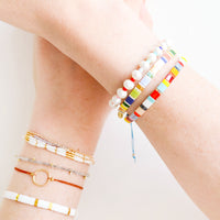 6: Model shot showing wrists with multiple styles of bracelets.