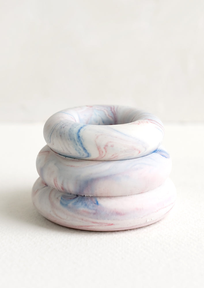 July Marble: A taper candle holder with 3-layer stacked donut shape in blue and red marble.