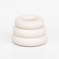 Chalk White: A taper candle holder with 3-layer stacked donut shape in white.