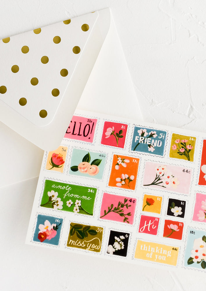 1: A greeting card with illustrations of postage stamps.