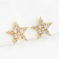 1: A pair of gold star shaped stud earrings with crystal pave detailing.