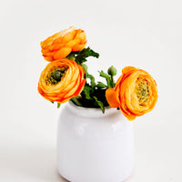 Large / White: Round, white, rustic ceramic vase in glossy finish, pictured with orange flowers
