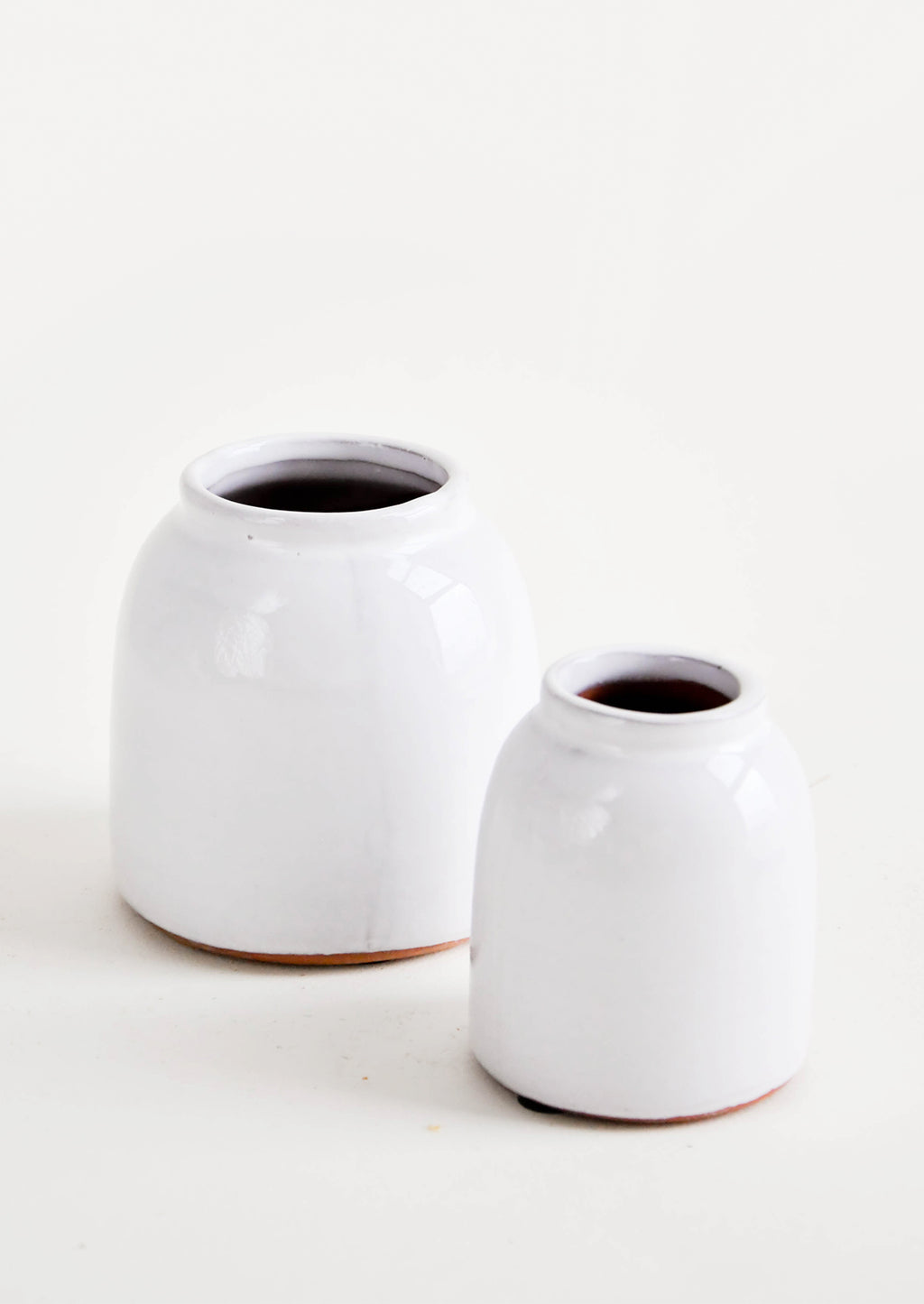 Small / White: Round, white, rustic ceramic vases in glossy finish