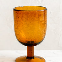 Short / Amber: A short stemware glass in amber color.