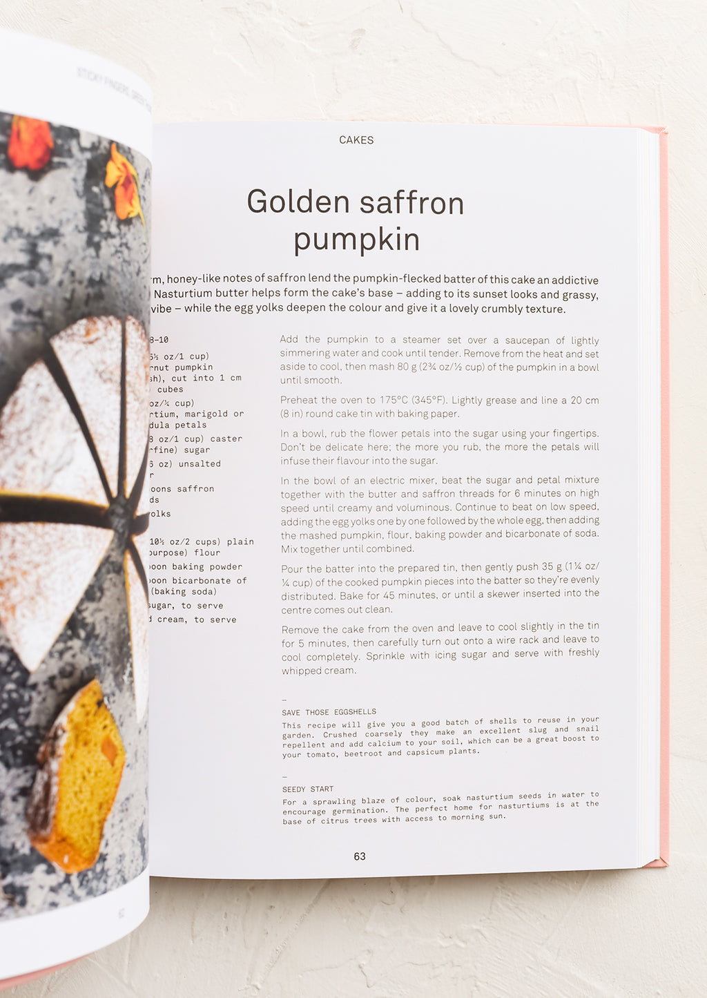 3: A cookbook open to a page with recipe for Golden saffron pumpkin cake.