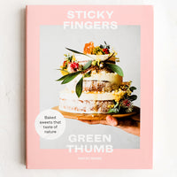 1: A cookbook with image of cake on cover.