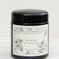 Jasmine: A jasmine scented candle in black jar with black and white botanical label.
