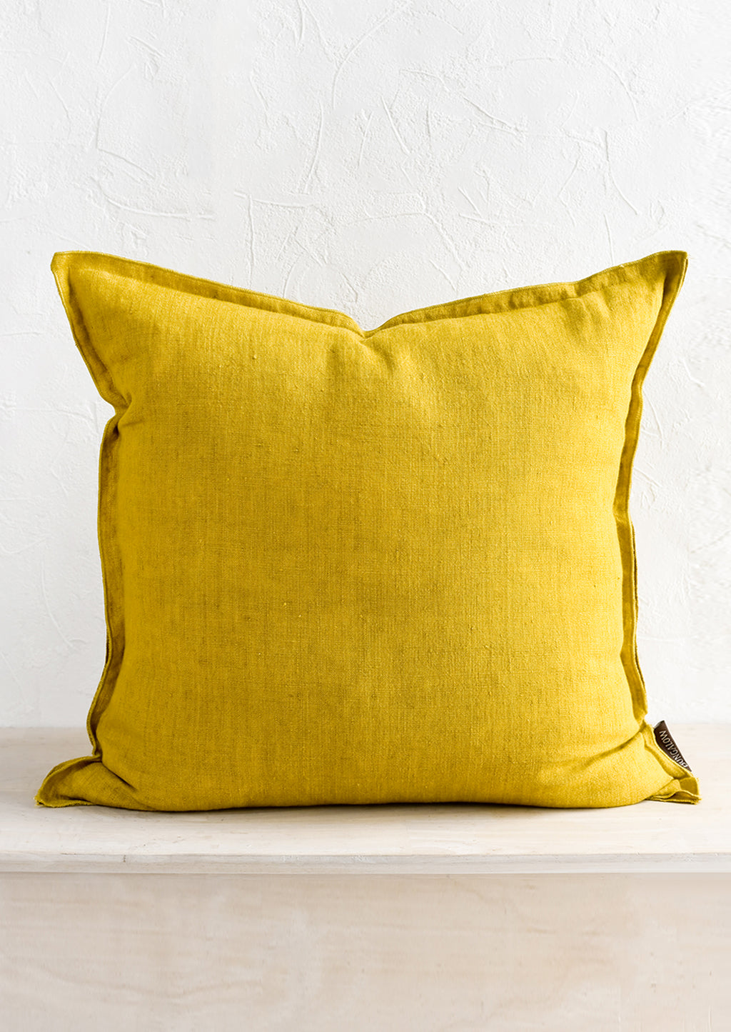 Citron: A solid linen pillow in citron yellow.