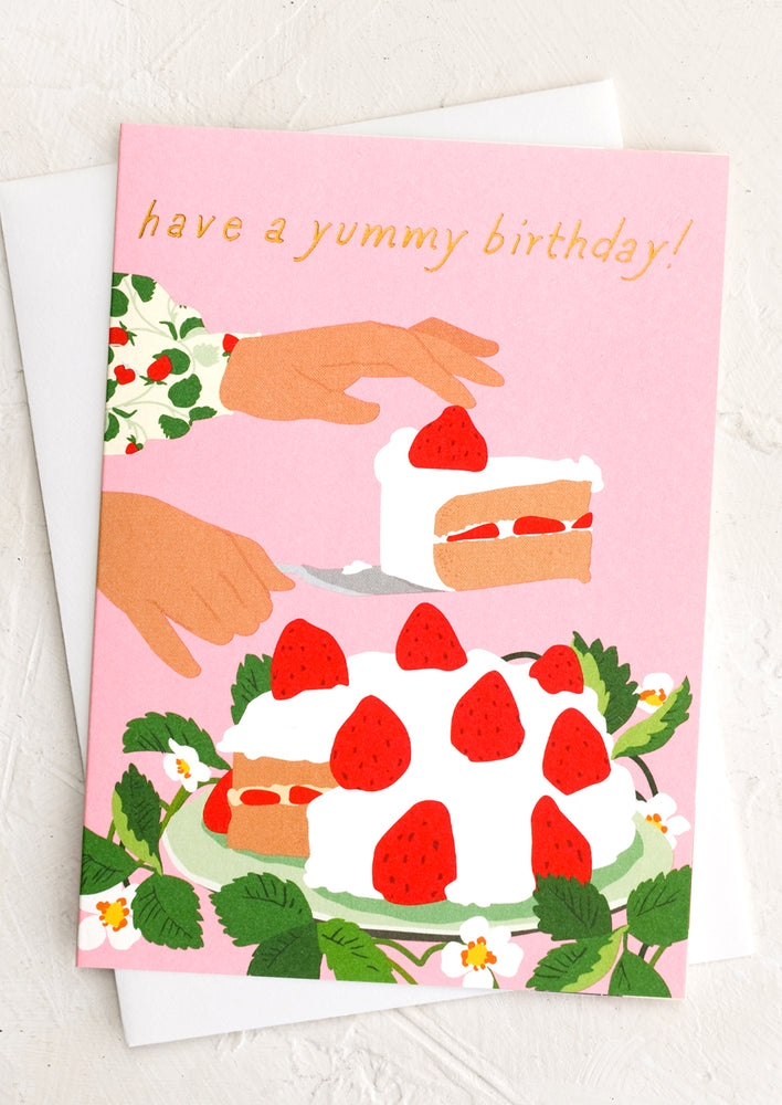 1: A pink greeting card with illustration of a woman serving a strawberry cake, text at top reads "Have a yummy birthday!".