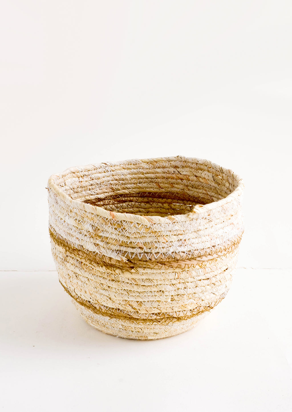 Small [$24.99]: Small, round storage basket woven from natural maize fiber with tan stripes 