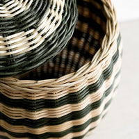 2: A tall hive shaped lidded basket in natural and dark green stripes.