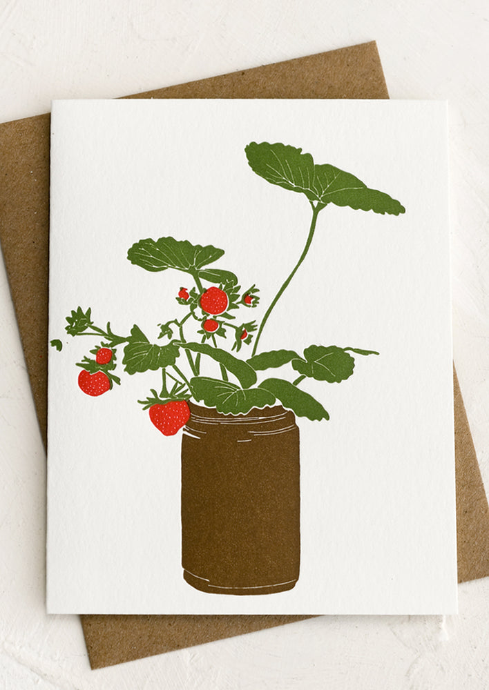 A letterpress greeting card with potted strawberry print.