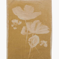 No. 1: A yellow cotton tea towel with "bleached" look floral print.