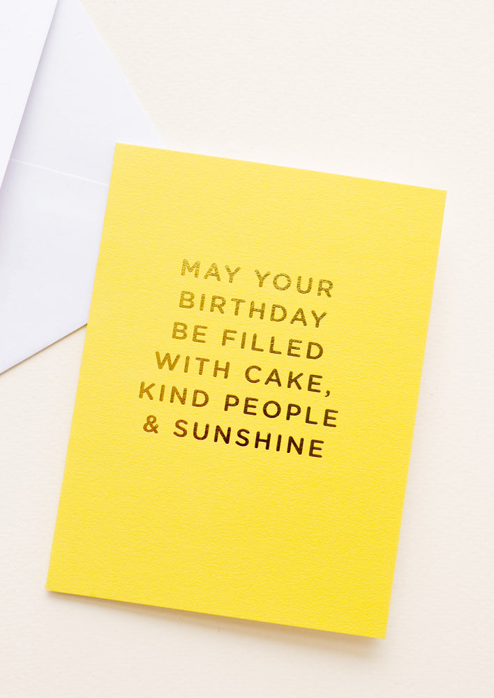 1: Yellow notecard with the text "May Your Birthday Be Filled With Cake, Kind People & Sunshine" in gold foil.