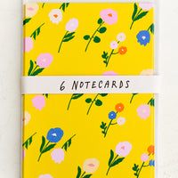 2: A set of yellow greeting cards with colorful floral print.