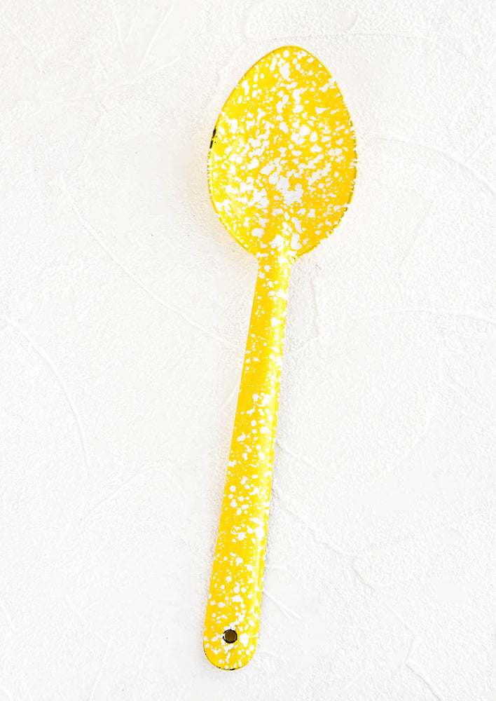 Enamel coated metal spoon in yellow and white splatter print