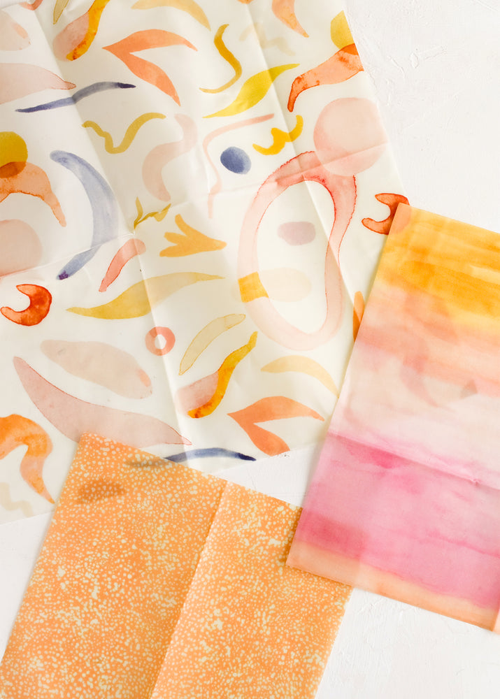 1: Three beeswax wraps in small, medium and large in colorful mixed prints.