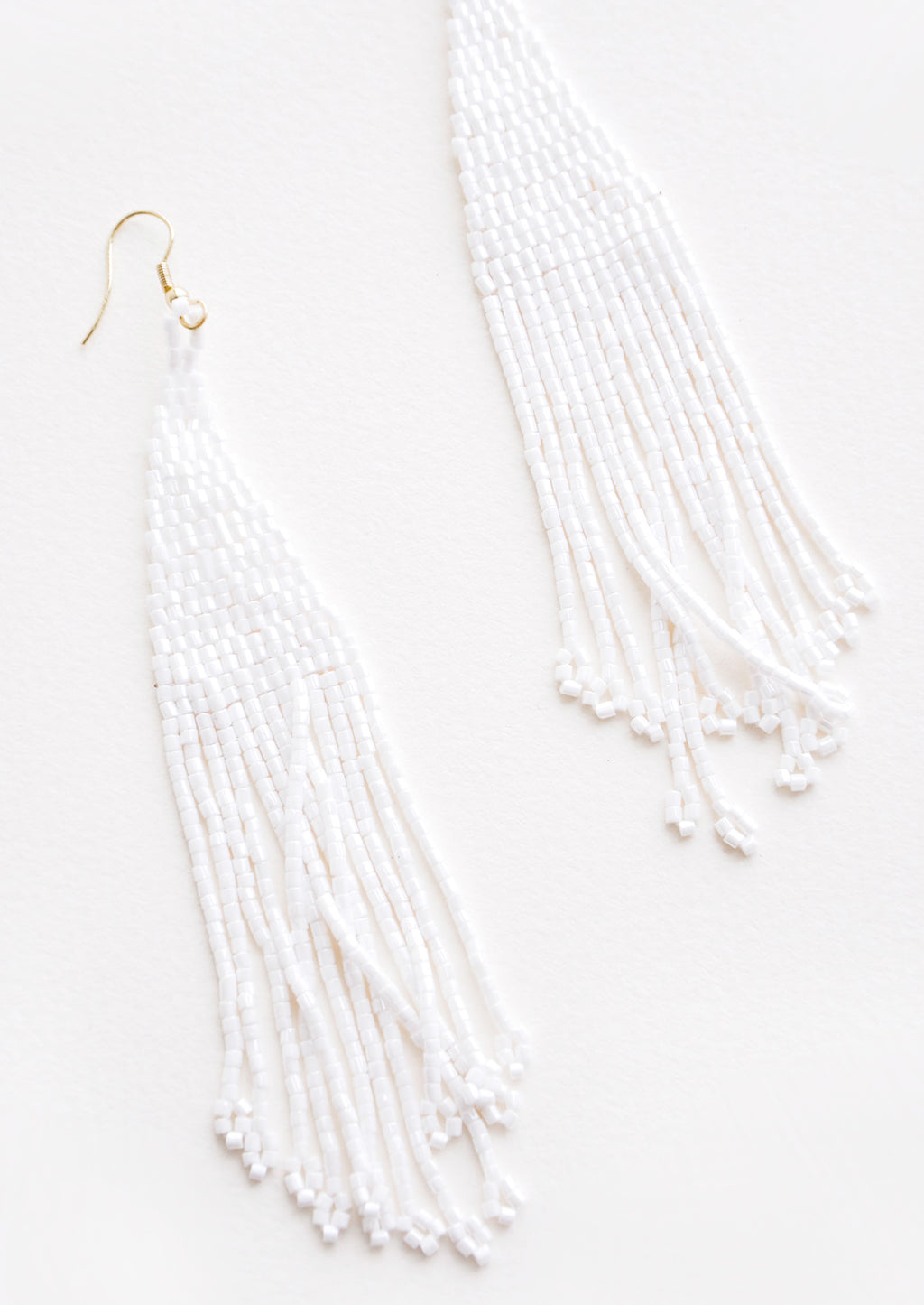 Iridescent White: True white iridescent beaded fringe earrings. 