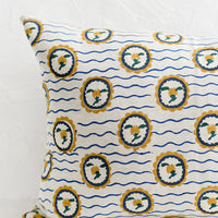 2: A block printed pillow with wavy floral motif.