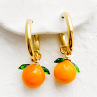 1: Gold huggie hoop earrings with glass tangerine charms.