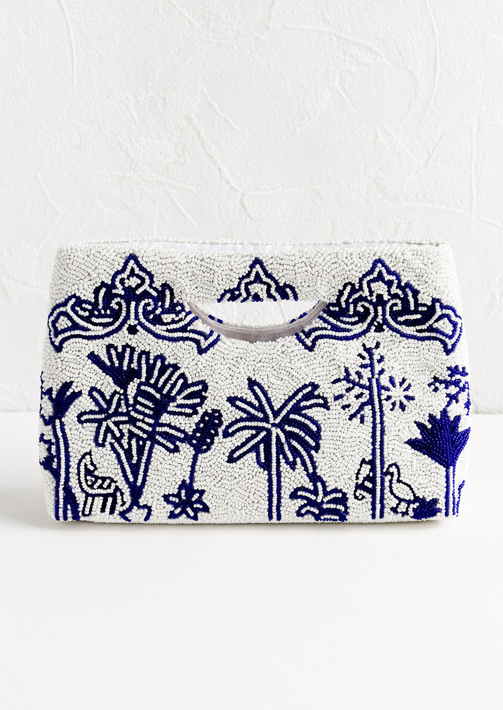 1: A white and blue beaded clutch.