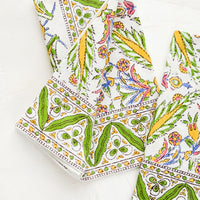 2: A block printed pair of napkins in green, yellow, blue and pink pattern.