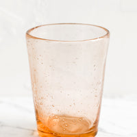 Melon: A glass tumbler cup in melon seeded glass.