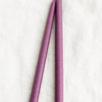 Elderberry: A pair of taper candles in elderberry purple.