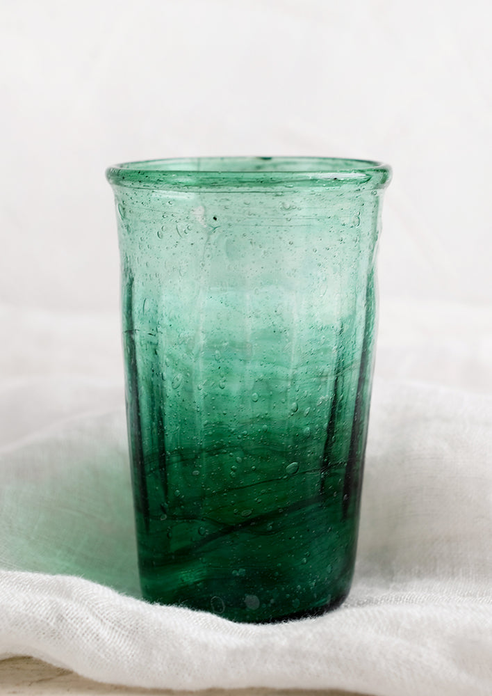 A glass tumbler in jade color.