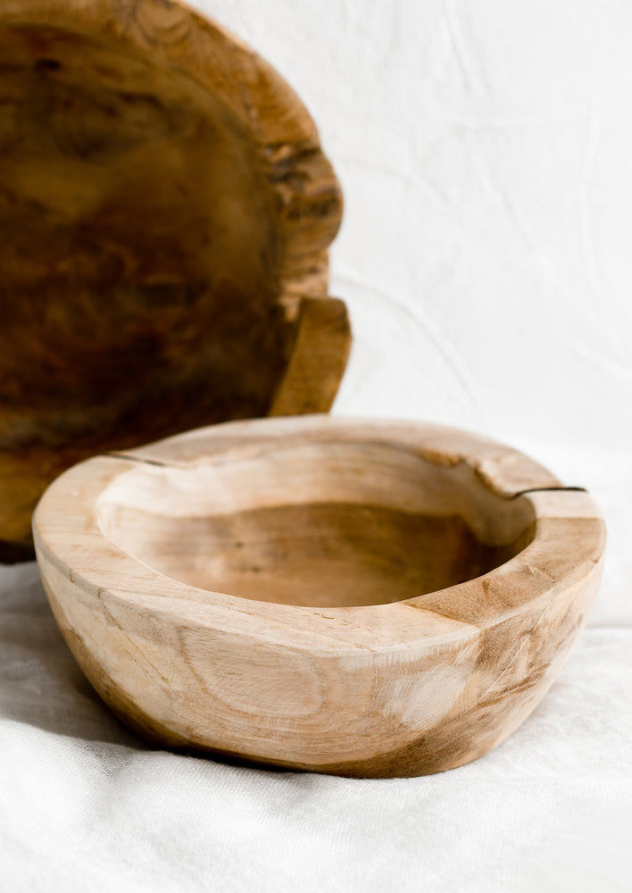3: Natural teakwood bowls in variations of light and dark.