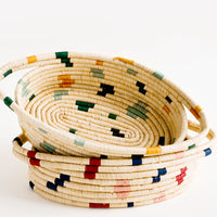 2: Oval shaped, woven raffia baskets with terrazzo inspired print