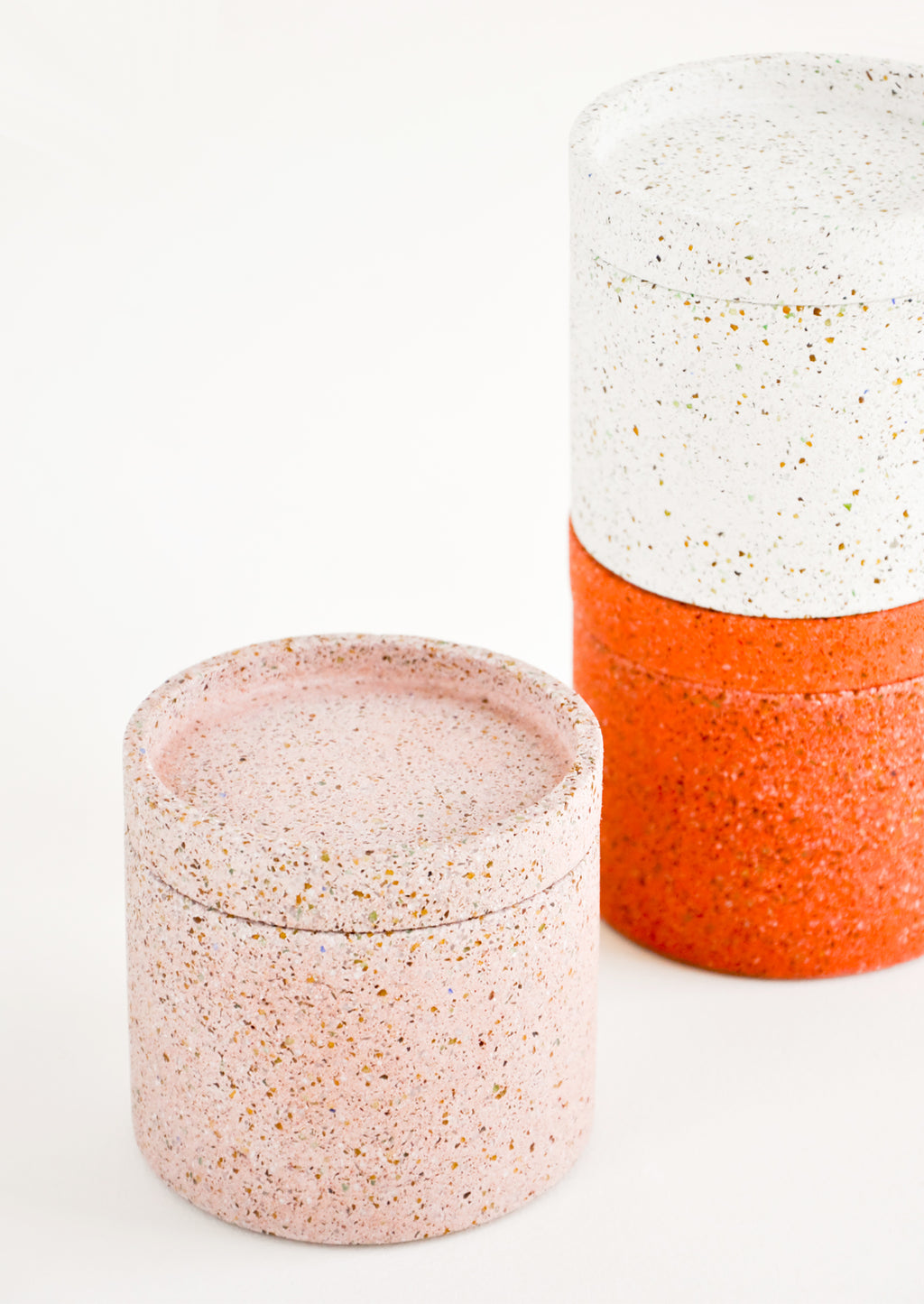 2: Stack of Colored Concrete Storage Jars with Speckled Glass Flecks