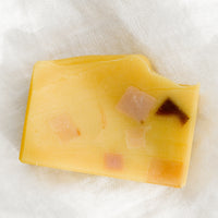 Terrazzo Citrus Rose: A yellow colored bar of soap with multicolor terrazzo pattern.