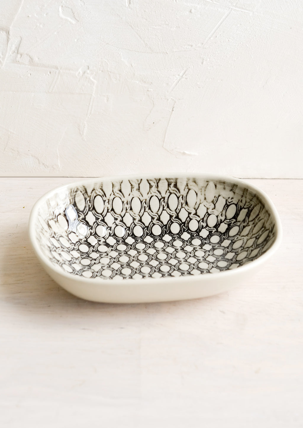Woven Rope Print: A small oval ceramic dish in rope pattern.