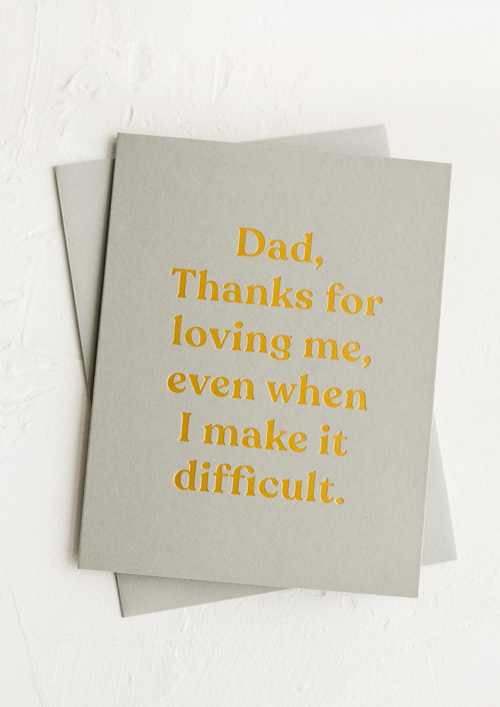 A greeting card that reads "Dad, thanks for loving me, even when I make things difficult".