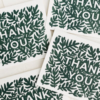 Boxed Set of 6: A set of greeting cards with green leaf print reading "Thank You".