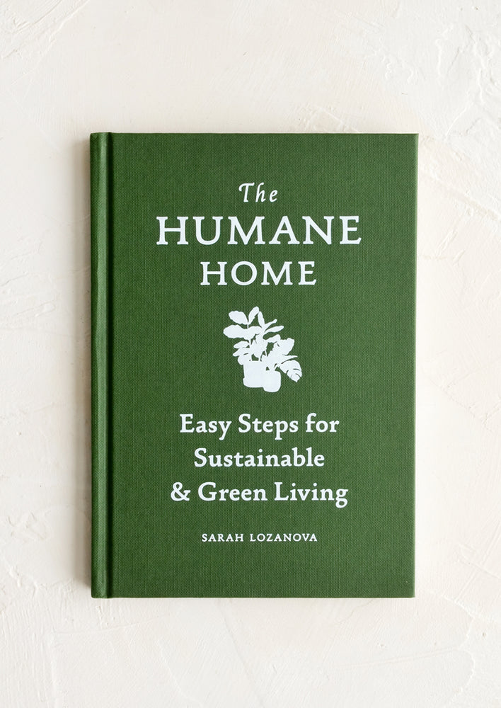 A green book with white text titled "The Humane Home".