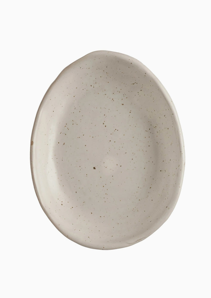 2: An egg shaped trinket dish in speckled white ceramic.