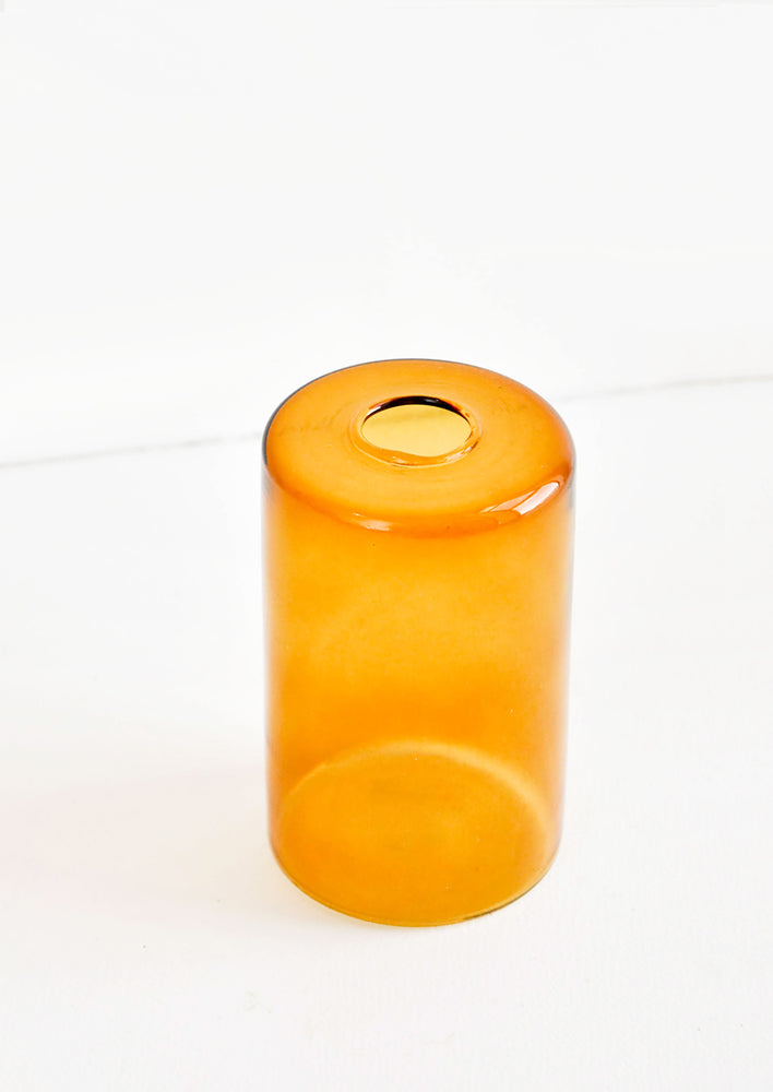 Colored glass flower vase in amber glass