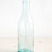 Clear: Wine-bottle shaped glass bottle in clear recycled glass