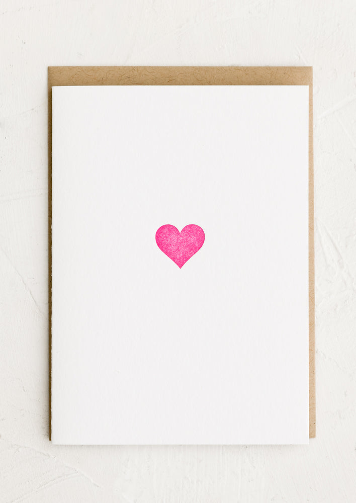 1: A plain white card with pink heart.