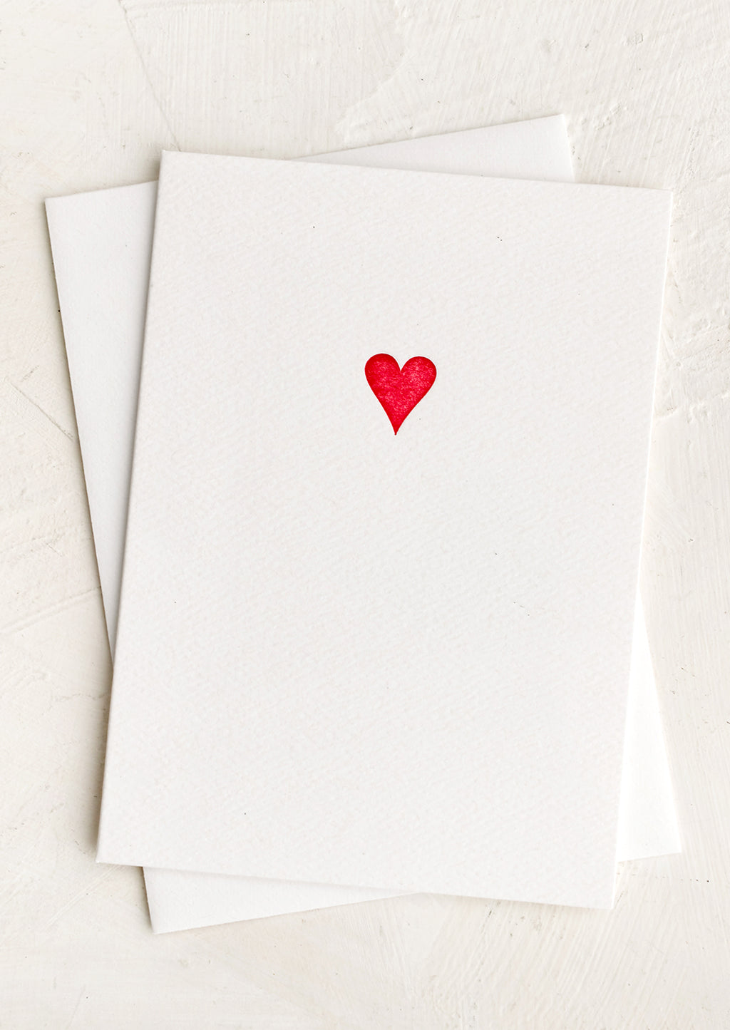 Red Heart: A plain white card with small red heart icon at front.
