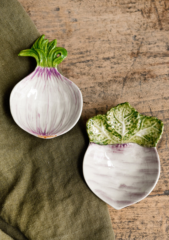 Ceramic dishes in the shape of an onion and turnip.