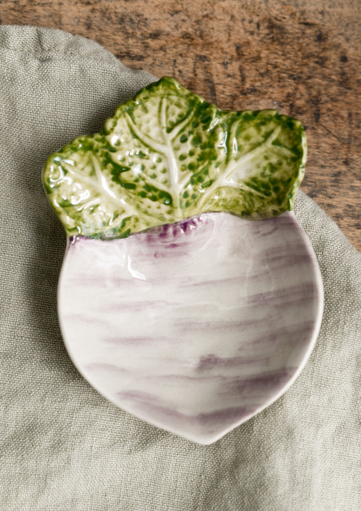 A ceramic veggie dish in the shape of a turnip.