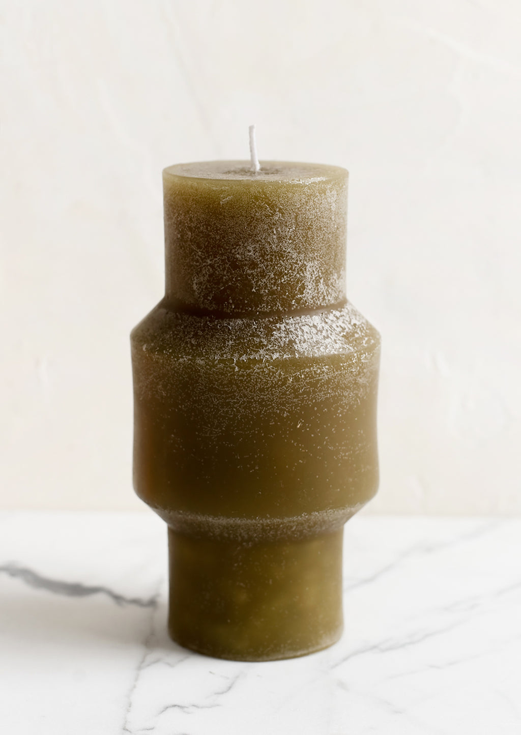 Medium (Plateau) / Olive: A medium carved pillar candle with waxy finish in olive.