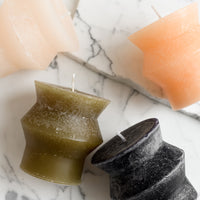 Small / Black: Assorted colors of small geometric shaped pillar candles.