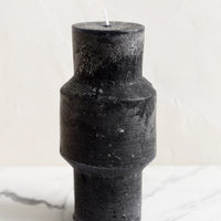 Medium (Plateau) / Black: A medium carved pillar candle with waxy finish in black.
