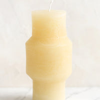 Medium (Plateau) / Vanilla: A medium carved pillar candle with waxy finish in vanilla.